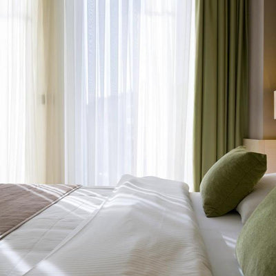 Inexpensive bedroom makeovers using voiles & nets