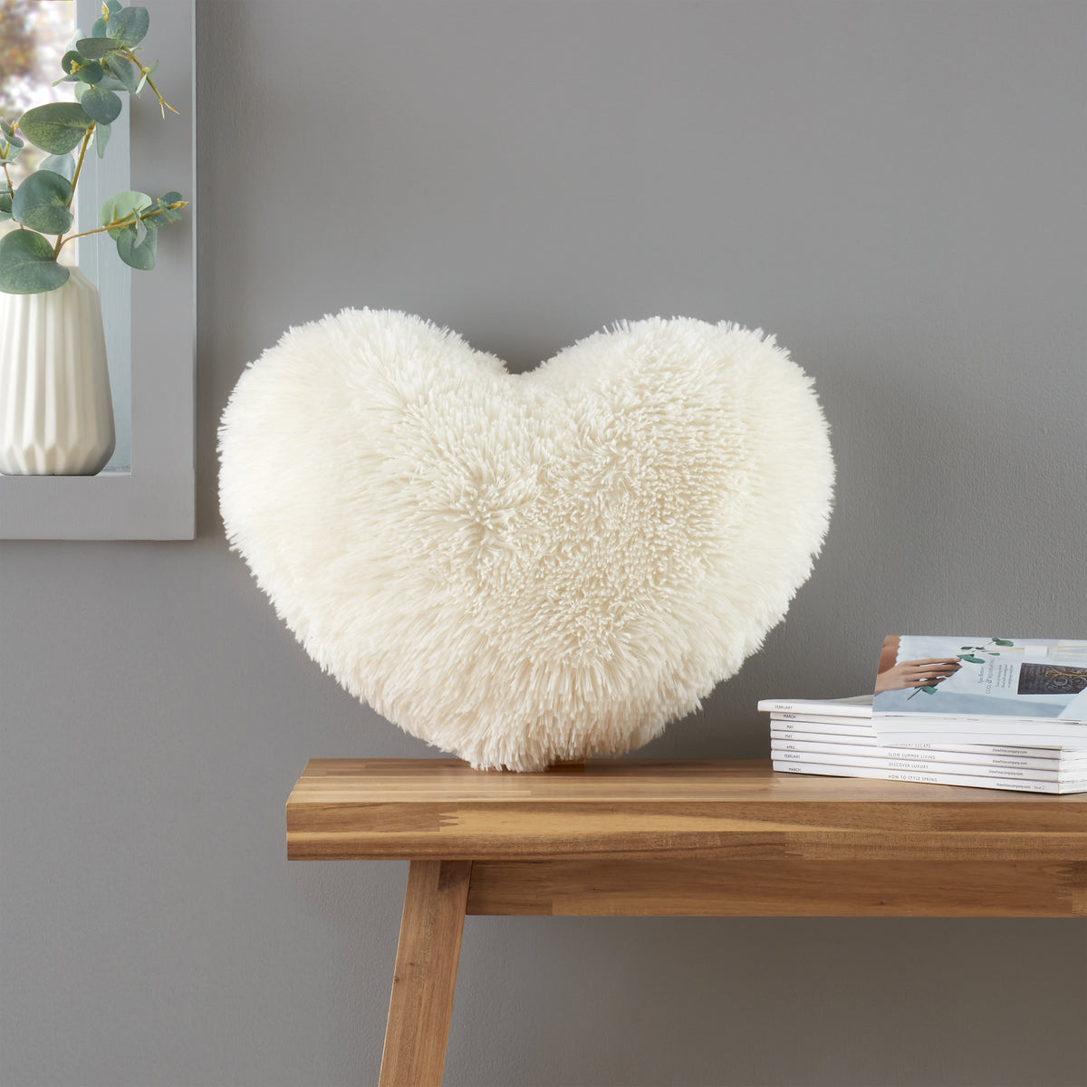 Catherine Lansfield Cuddly Faux Fur Heart Shaped Filled Cushion 38cm x 28cm Cream