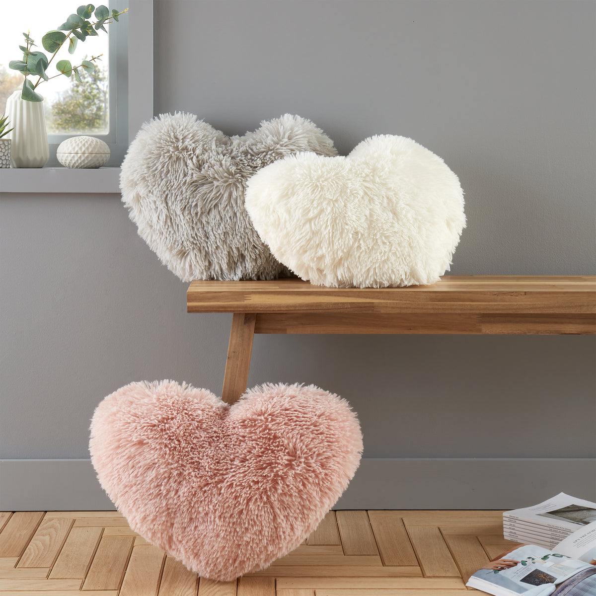Catherine Lansfield Cuddly Faux Fur Heart Shaped Filled Cushion 38cm x 28cm Cream