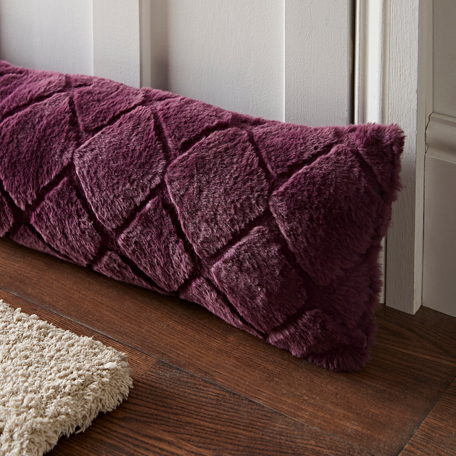 Catherine Lansfield Cosy Diamond Faux Fur Draught Excluder Plum