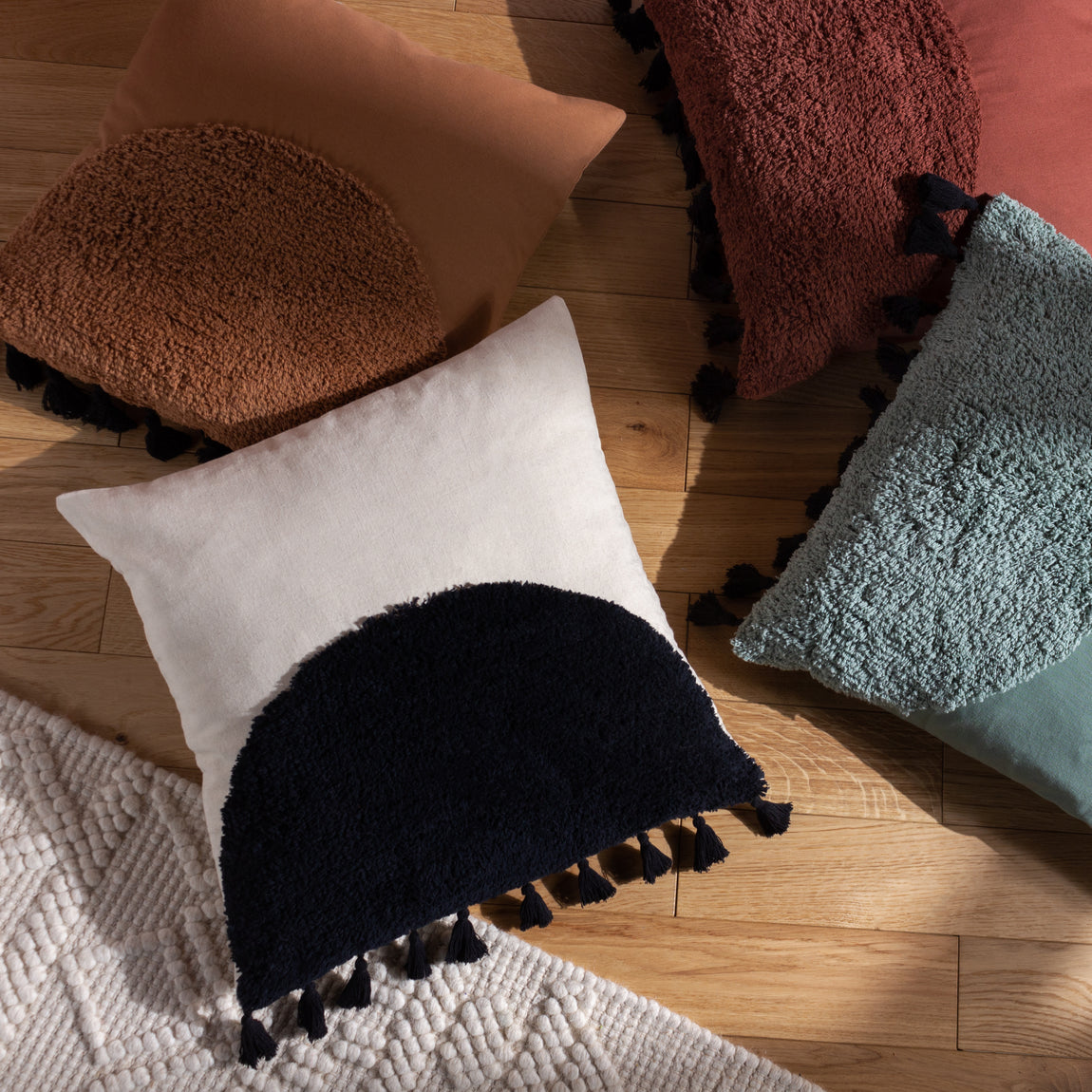 furn. Radian Semi Circle Tufted Cotton Tasselled 45cm x 45cm Filled Cushion Cinnamon